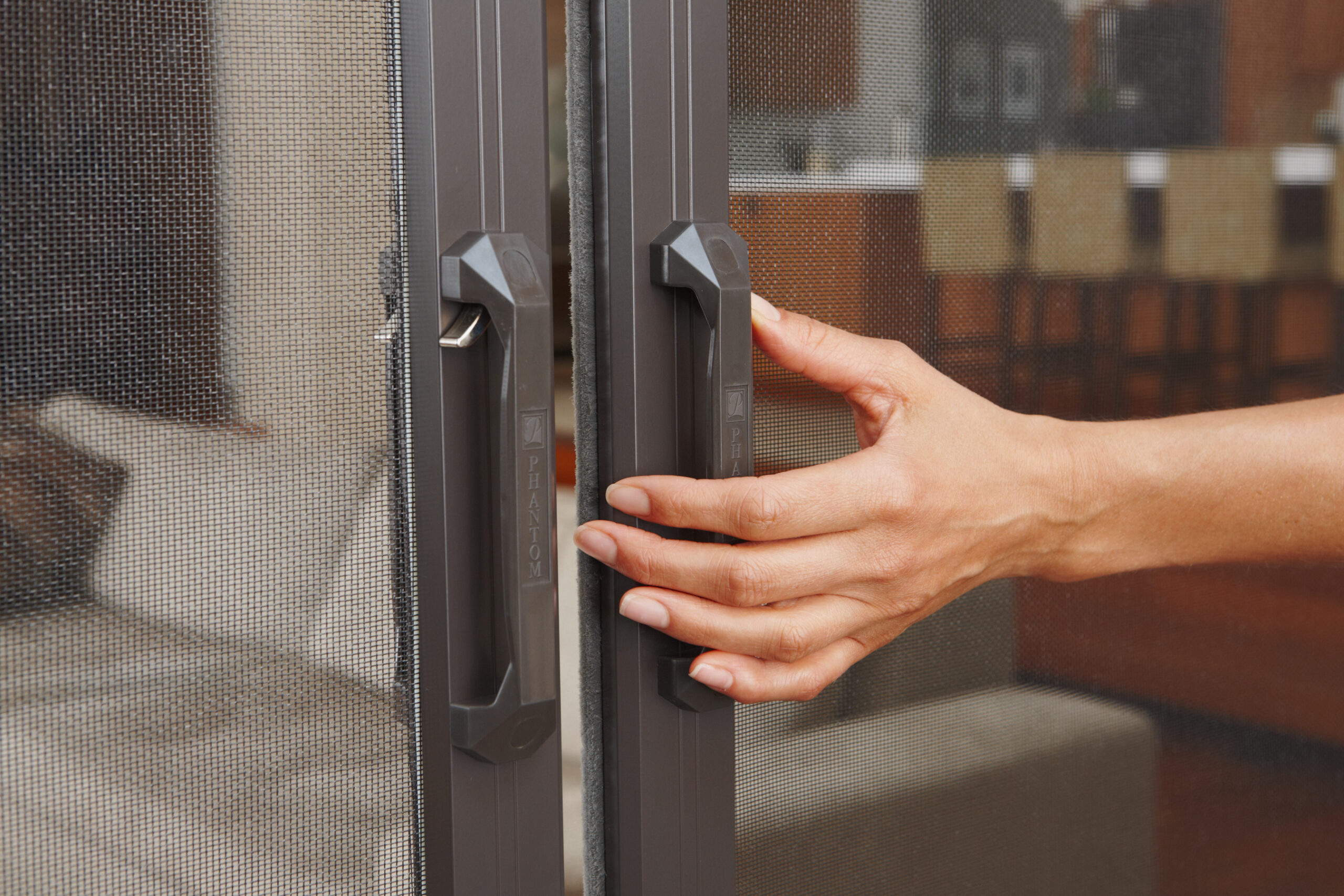 Phantom Screens latching handle system for retractable screen doors, in Aldergrove, BC.