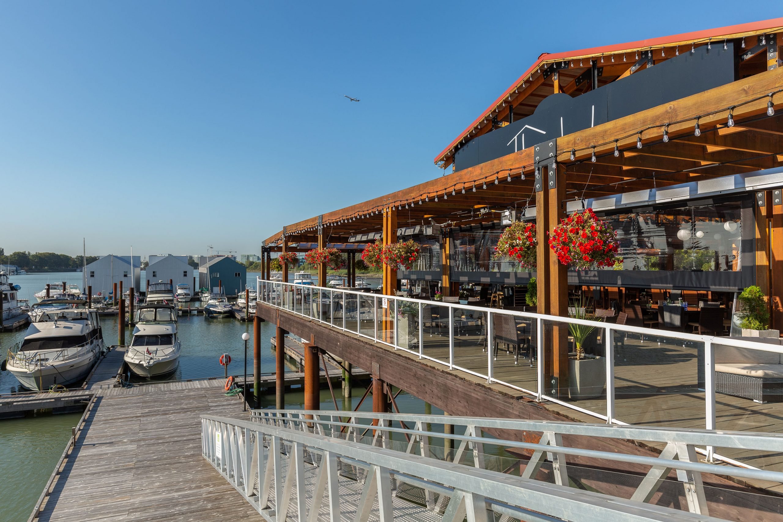 Restaurant patio by ocean with Phantom motorized screens