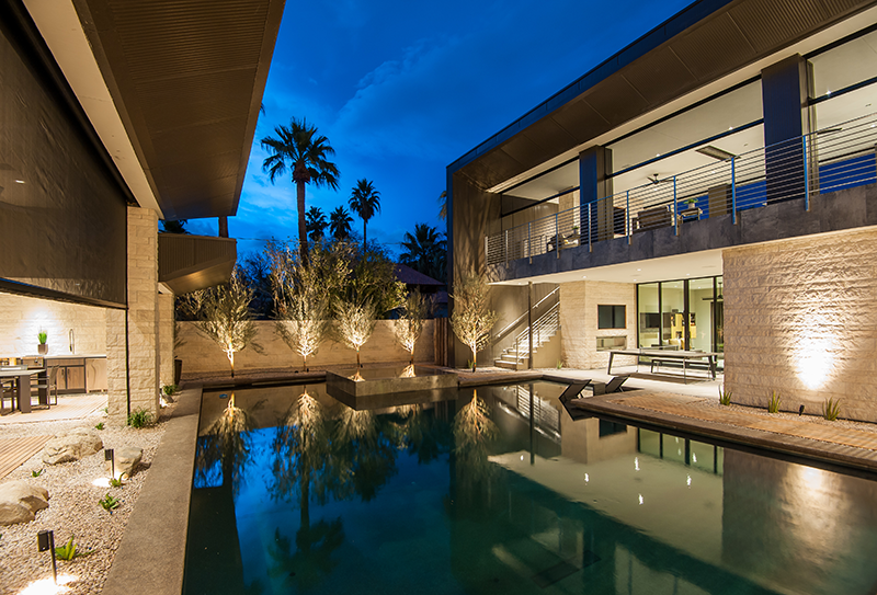 Luxury home with pool and motorized screens