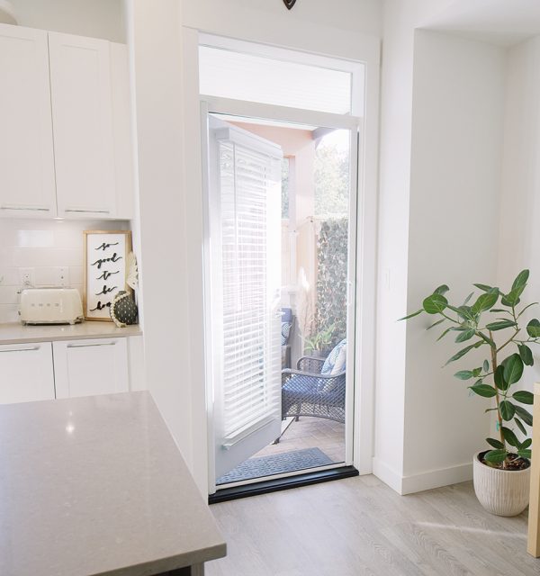White modern kitchen with retractable single door screen