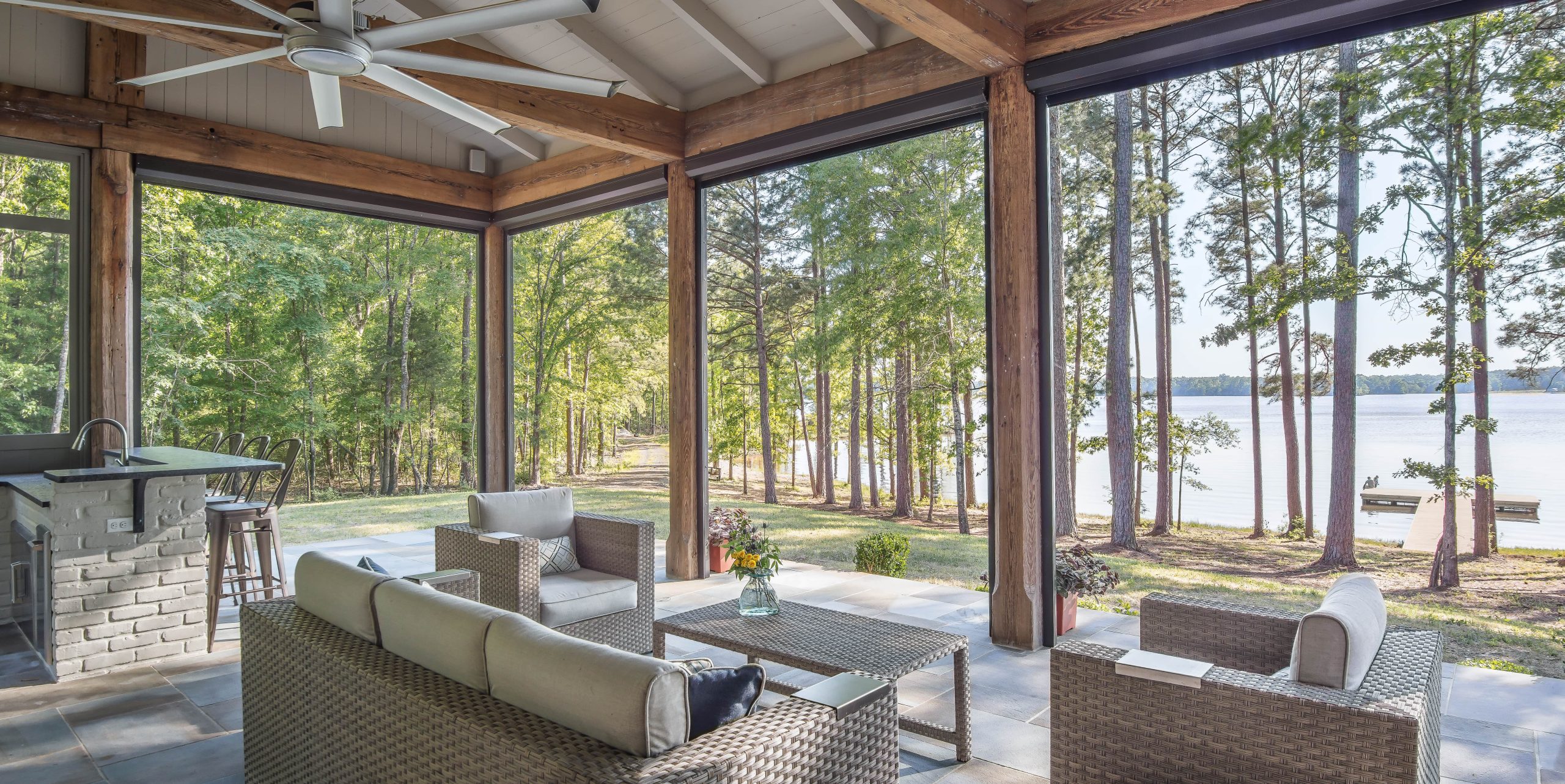 Lakehouse patio encased in motorized screens