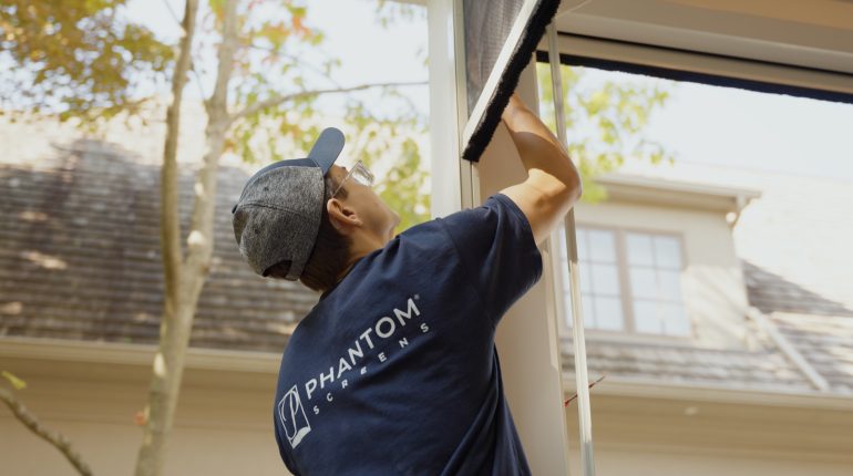 Phantom Screens installer working on a phantom motorized screen