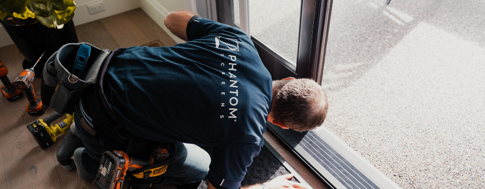 Phantom Screens distributor installing screen door