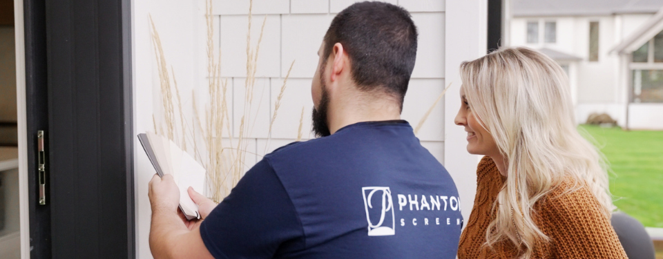 Phantom Screens expert showing homeowners color swatches